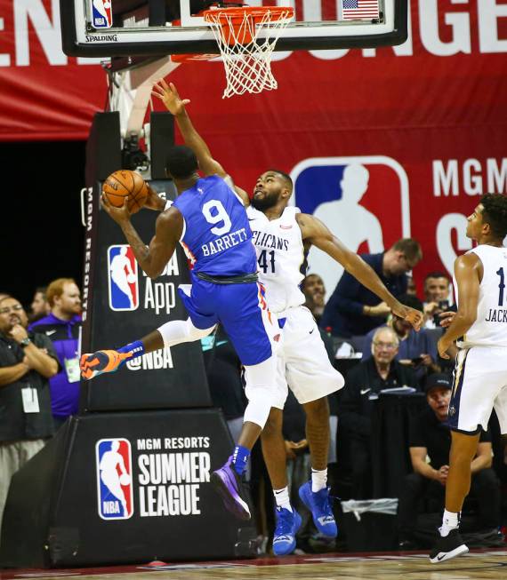 New York Knicks' RJ Barrett goes to the basket against Javon Bess (41) during the first half of ...