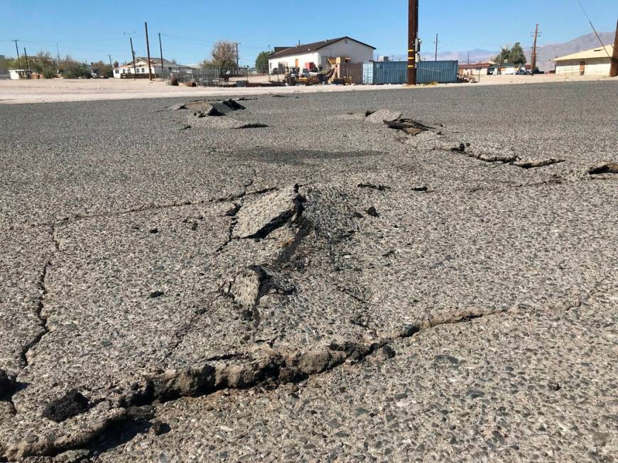 A road is damaged from an earthquake Thursday, July 4, 2019, in Trona, Calif. A strong earthqua ...