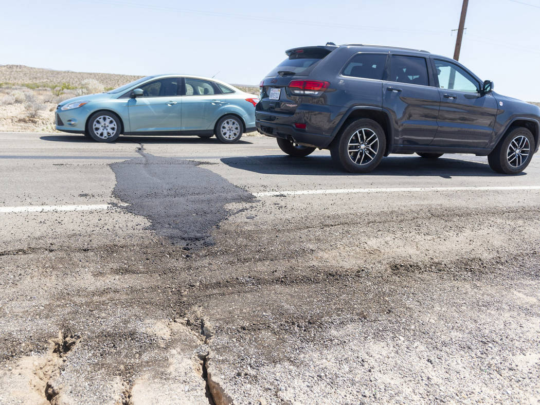 Traffic drives over a patched section of Highway 178 between Ridgecrest and Trona, Calif., on F ...