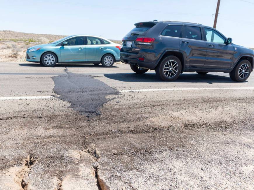 Traffic drives over a patched section of Highway 178 between Ridgecrest and Trona, Calif., on F ...