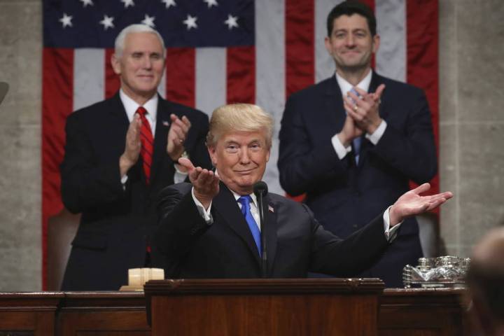 President Donald Trump gestures as delivers his first State of the Union address in the House c ...