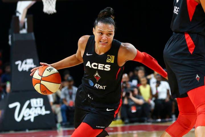 Las Vegas Aces' Kayla McBride (21) moves the ball against Chicago Sky during the first half of ...