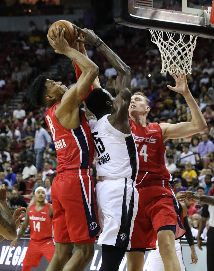 The Washington Wizards' forward Rui Hachimura (8) goes for a rebound against the Brooklyn Nets ...