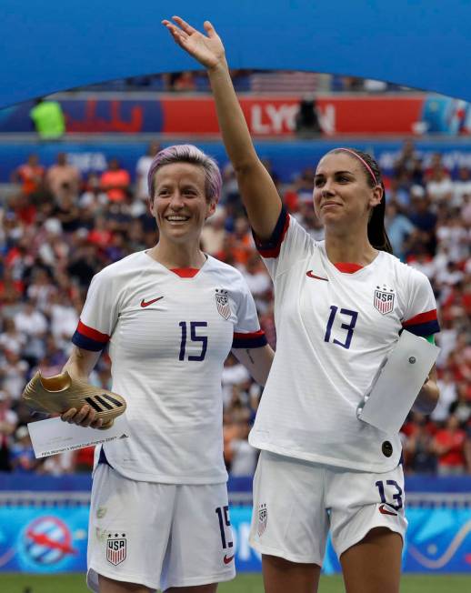 United States' Megan Rapinoe, left, and her teammate Alex Morgan, right, after winning the Wome ...