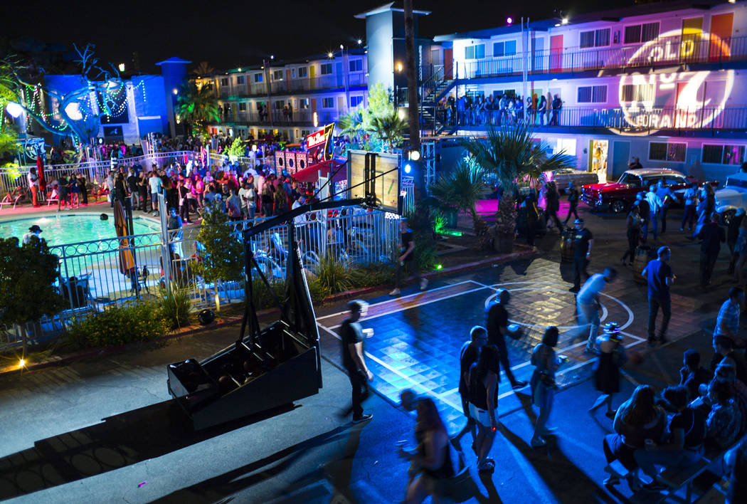 Attendees walk by the basketball court at Jack Daniel's House No. 7, a pop-up experience at the ...