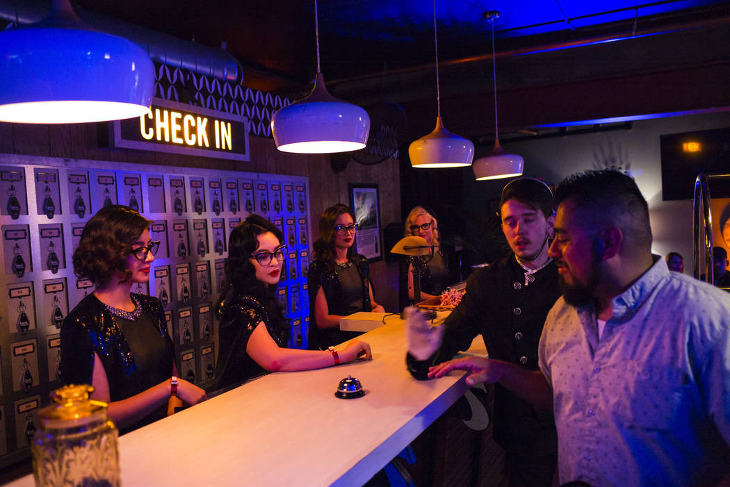 Attendees stop by the check in desk during the Jack Daniel's House No. 7, a pop-up experience a ...