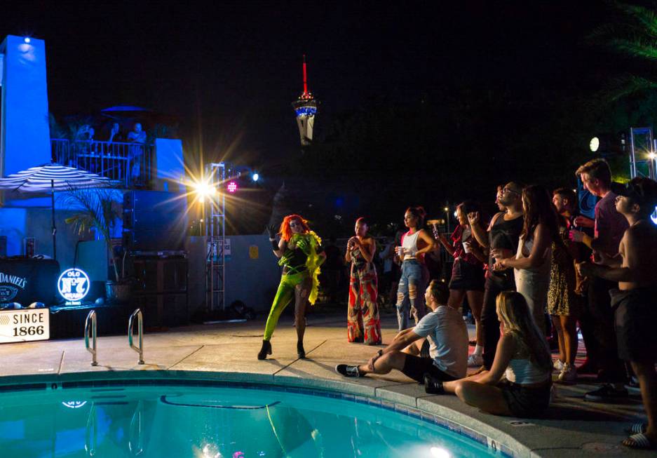 Attendees watch a drag show competition during the Jack Daniel's House No. 7, a pop-up experien ...