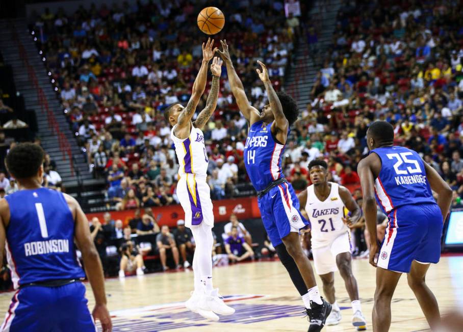 Los Angeles Lakers' Joe Young (0) shoots over Los Angeles Clippers' Terance Mann (14) during th ...