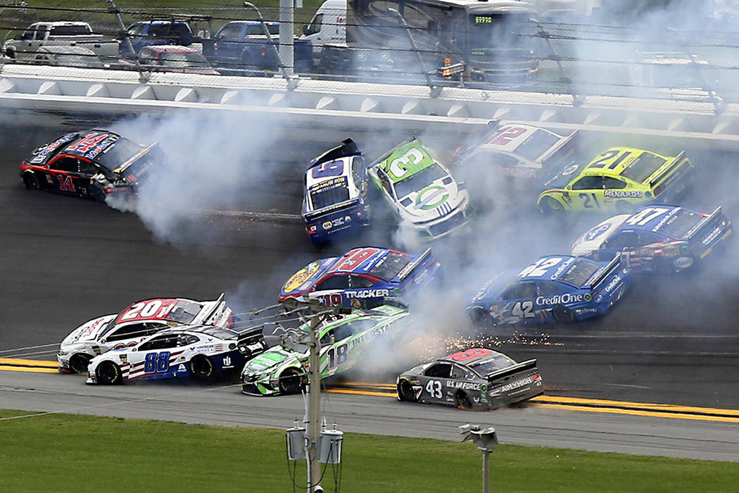 Cars crash, including Alex Bowman (88), Kyle Busch (18), Erik Jones (20), Darrell Wallace Jr. ( ...