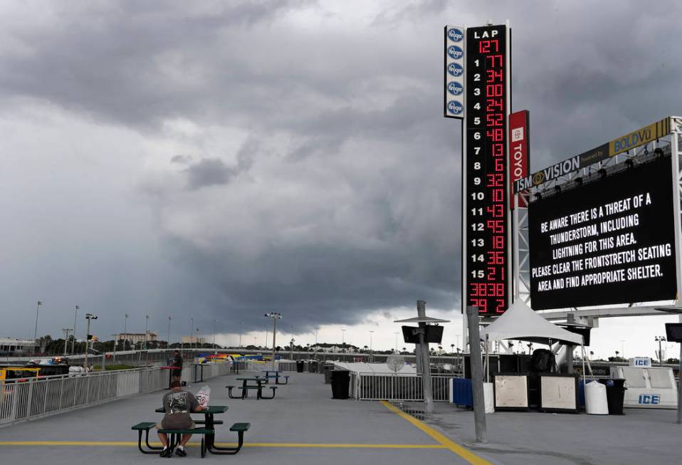 Storm clouds move over the Daytona International Speedway stopping the NASCAR Cup Series auto r ...