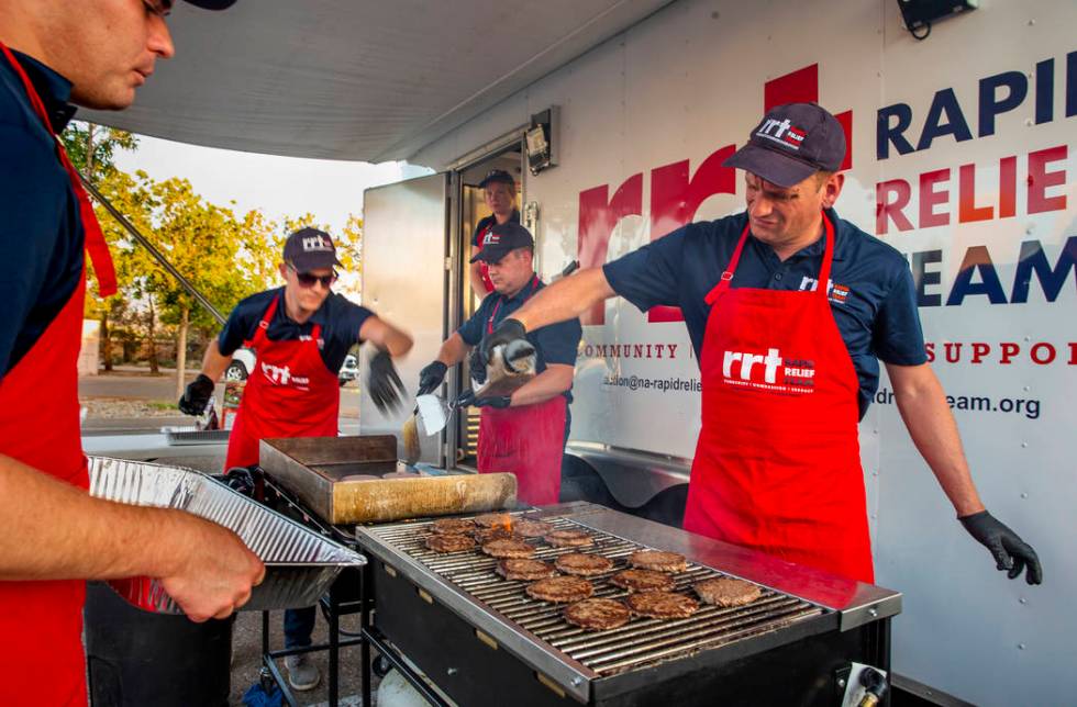 Members of a Red Cross Rapid Relief Team prepare to serve hamburgers to clients at the Ridgecre ...