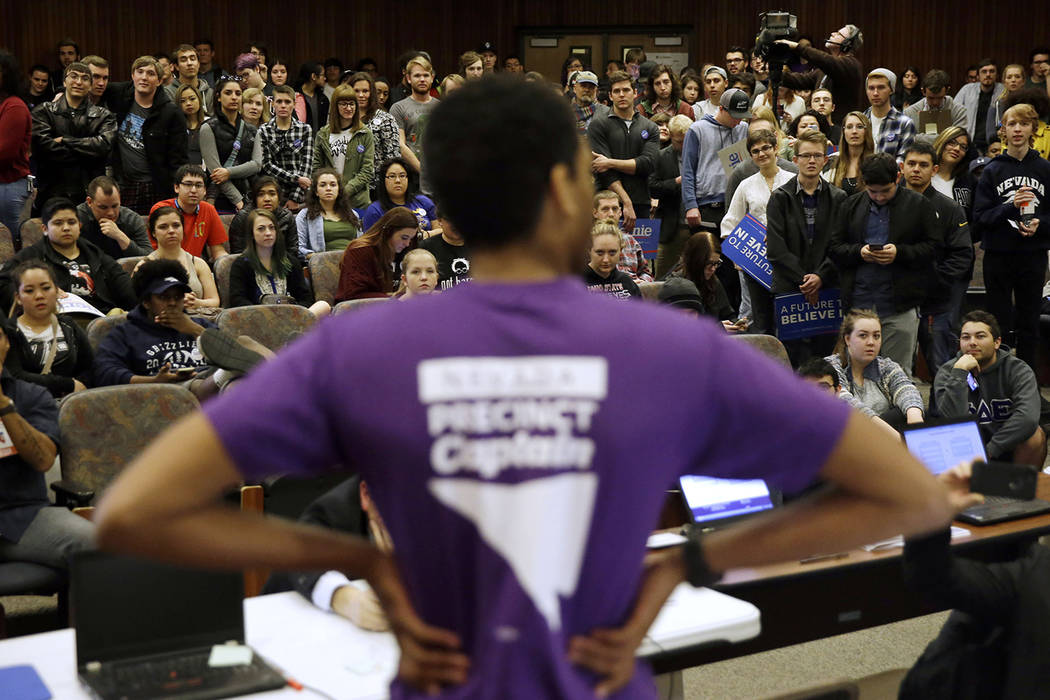 In a Feb. 20, 2016, file photo a precinct captain argues his position during a Democratic caucu ...