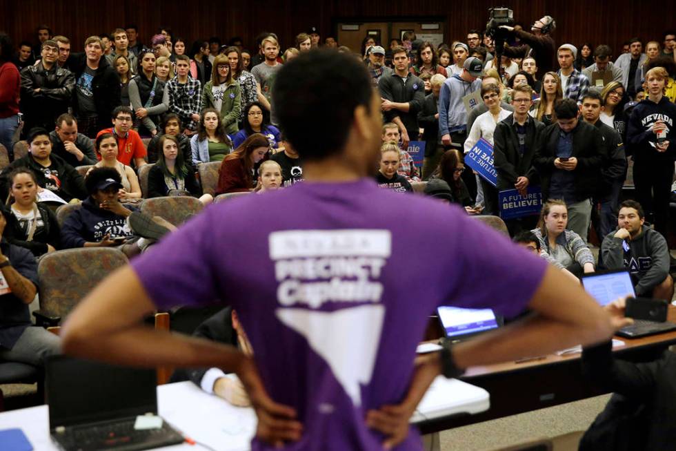 In a Feb. 20, 2016, file photo a precinct captain argues his position during a Democratic caucu ...