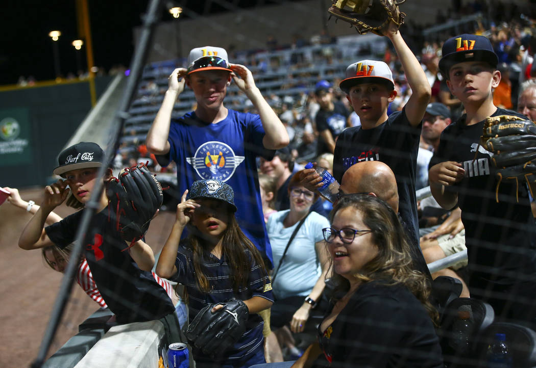 Las Vegas Aviators fans watch for players during the fourth inning at the Las Vegas Ballpark in ...