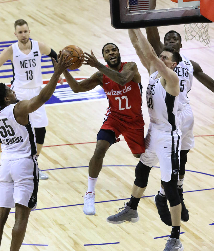 The Washington Wizards' guard Tarik Philip (22) goes for the basket as the Brooklyn Nets' guard ...