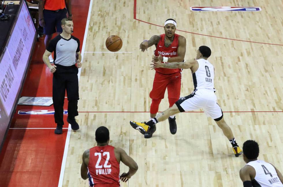 The Washington Wizards' guard Troy Caupain (14) passes the ball as the Brooklyn Nets' guard Jos ...