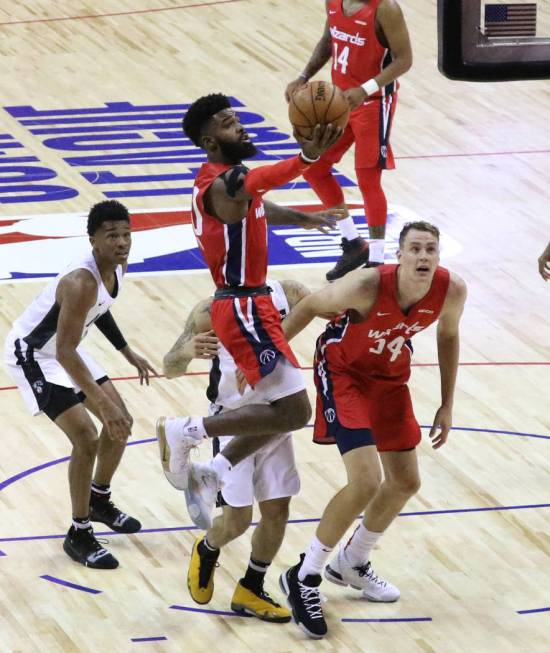 The Washington Wizards' guard Corey Davis (40) goes for the basket against the Brooklyn Nets' d ...