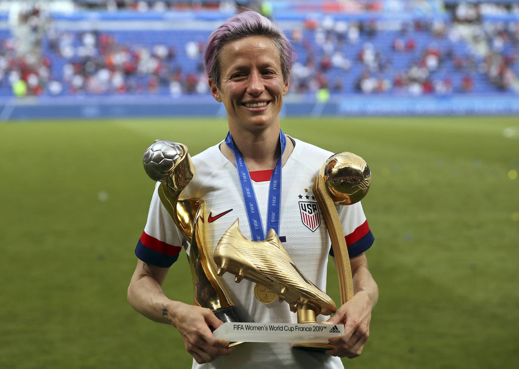 Megan Rapinoe of the United States poses with her individual awards at the end of the Women's W ...