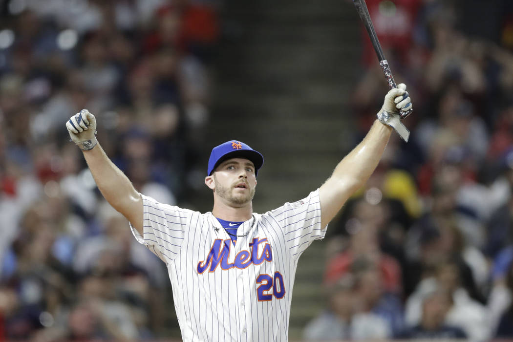 Pete Alonso, of the New York Mets, reacts after hitting during the first round in the Major Lea ...