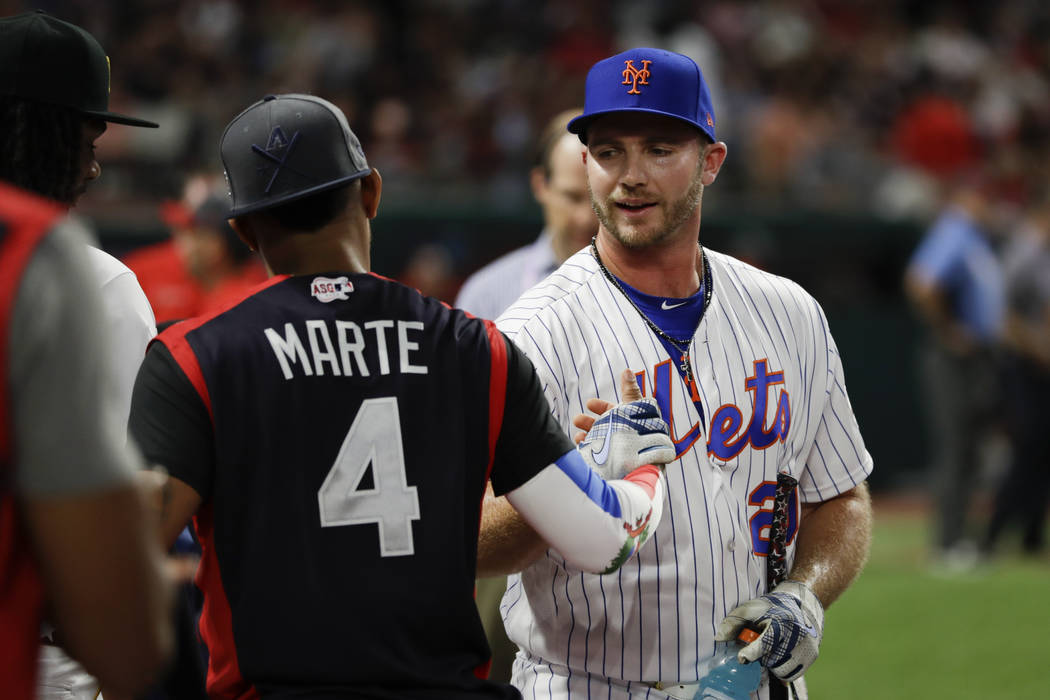 Pete Alonso, of the New York Mets, is congratulated by Ketel Marte, of the Arizona Diamondbacks ...