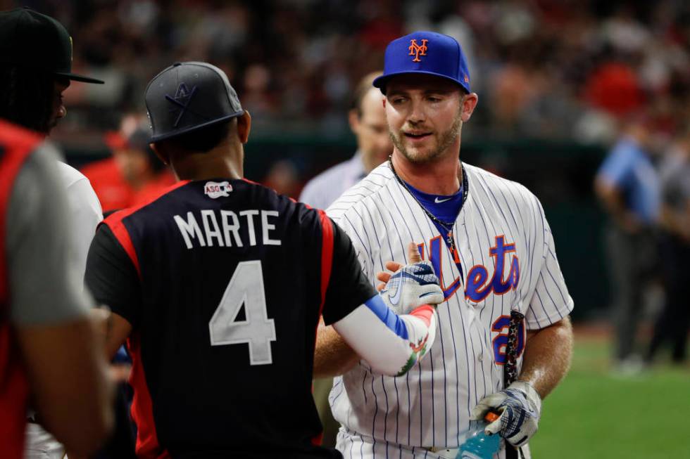 Pete Alonso, of the New York Mets, is congratulated by Ketel Marte, of the Arizona Diamondbacks ...