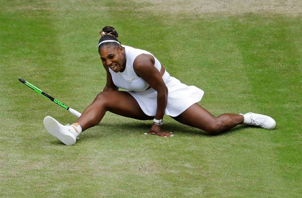 United States' Serena Williams does the splits after playing a return to United States' Alison ...