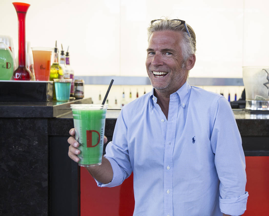 Jason Frankel holds a freshly poured 32-ounce frozen margarita on Friday, July 5, 2019, at the ...