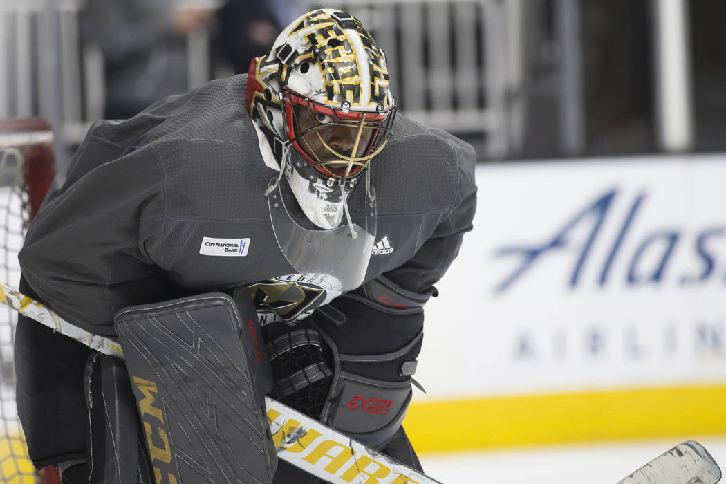 Golden Knights goaltender Malcolm Subban (30) peers out of his mask during practice on Thursday ...