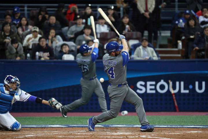 Israel's designated hitter Cody Decker, foreground, fouls off a pitch against South Korea durin ...