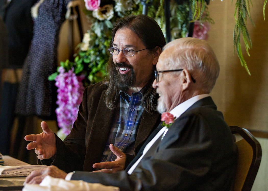 Historian Joe Thomson and Gail Andress talk about the past during a renewal of vows ceremony fo ...