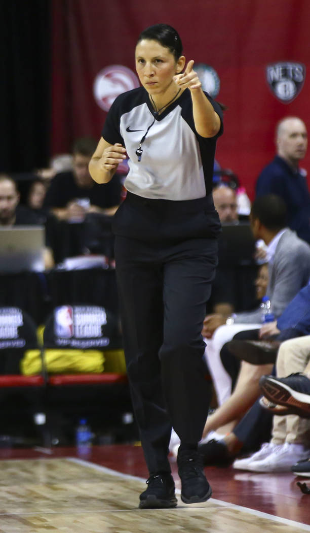 Referee Hortencia Sanchez-Carrizales motions while officiating a game between Phoenix Suns and ...