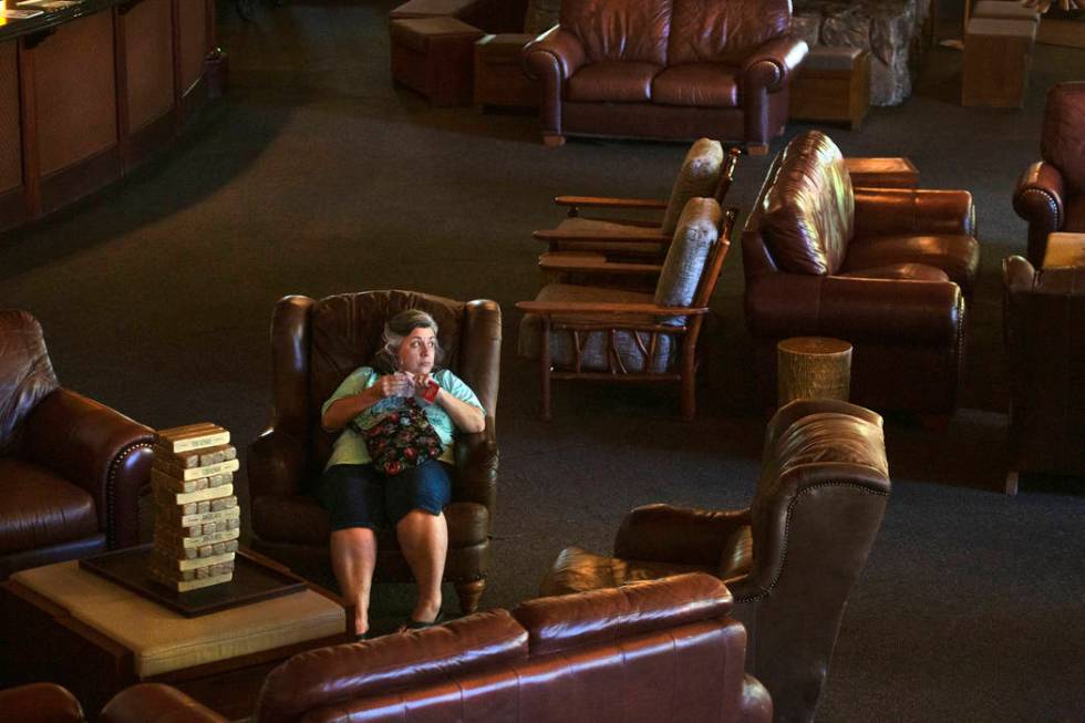 Mary, who choose to not give her last name, sits on a couch inside the The Resort on Mount Char ...