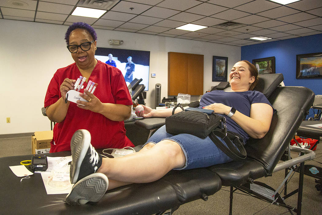 Barbara Moor, 57, prepares to draw blood from Audra Findley, during The American Red Cross bloo ...