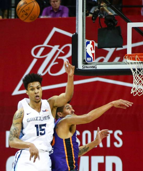 Memphis Grizzlies' Brandon Clarke (15) jumps for a rebound against Phoenix Suns' Derek Willis d ...