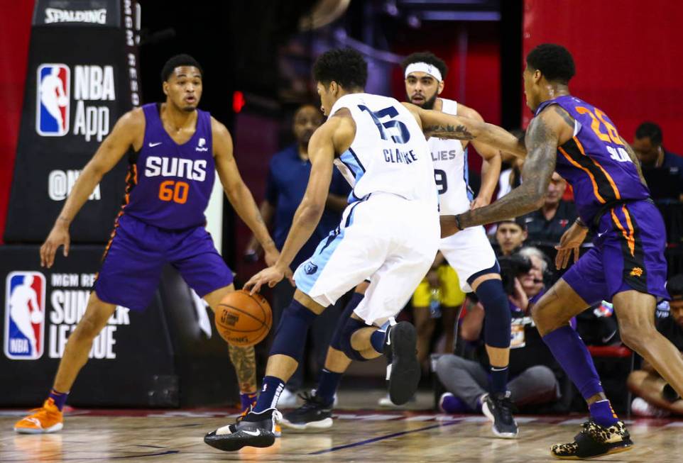 Memphis Grizzlies' Brandon Clarke (15) drives the ball against Phoenix Suns' James Palmer Jr. ( ...