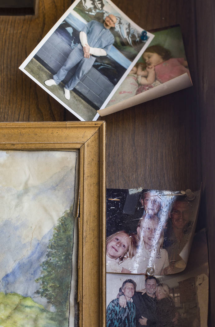 Photos tacked on the trailer wall on the property where Troy Ray died as a result of the July 4 ...