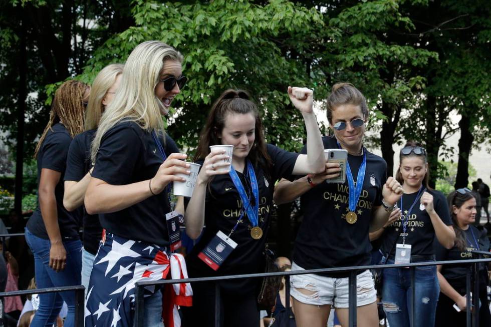 U.S. women's soccer team player Rose Lavelle, center, gestures while standing with teammates on ...