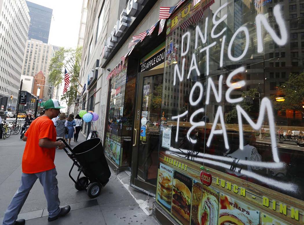 A spray-painted sign honors the four-time World Cup winning U.S. women's soccer team, one day a ...
