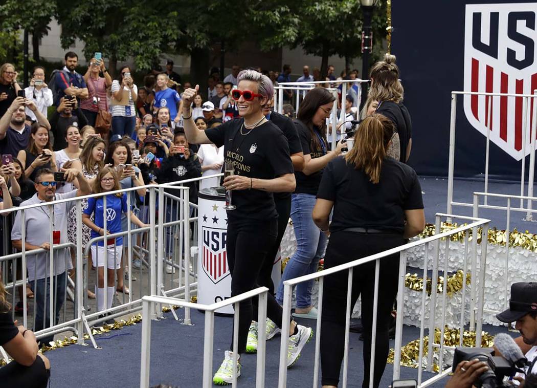 Megan Rapinoe with the U.S. women’s soccer team walks onto a float before the start of t ...