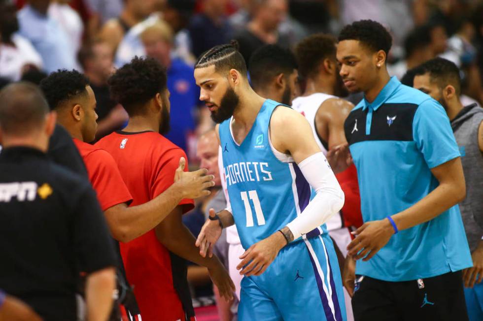 Charlotte Hornets' Cody Martin (11) shakes hands after playing against the Chicago Bulls at the ...