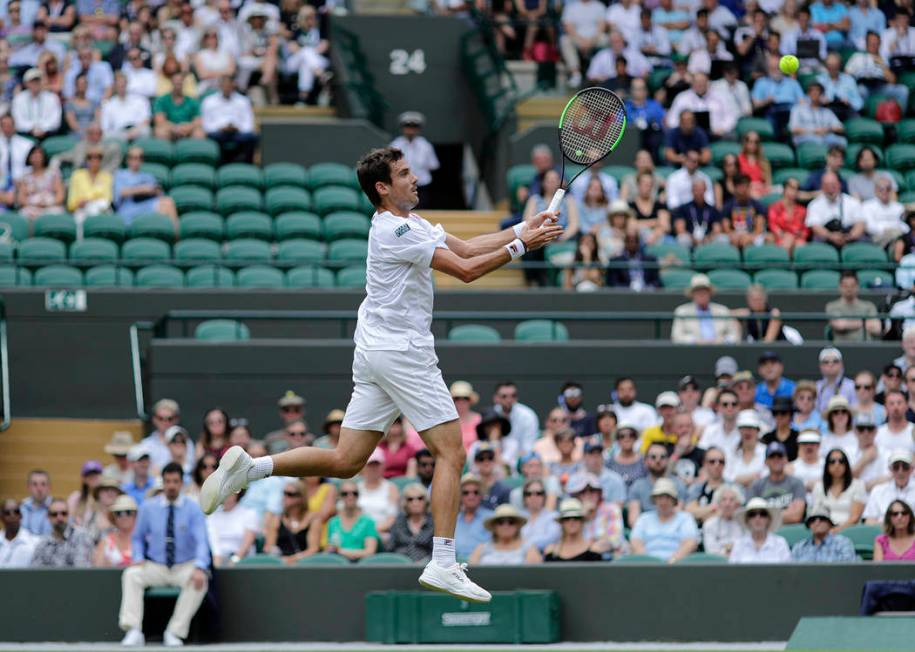 Argentina's Guido Pella returns the ball to Spain's Roberto Bautista Agut during a men's quarte ...