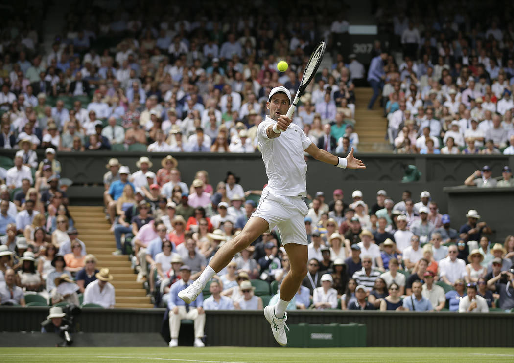 Serbia's Novak Djokovic returns the ball to Belgium's David Goffin during a men's quarterfinal ...