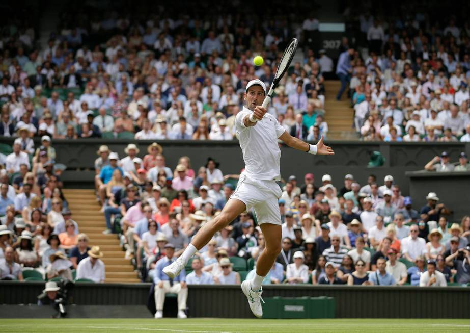 Serbia's Novak Djokovic returns the ball to Belgium's David Goffin during a men's quarterfinal ...