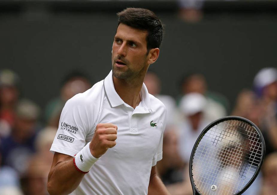 Serbia's Novak Djokovic celebrates winning the second set against Belgium's David Goffin during ...