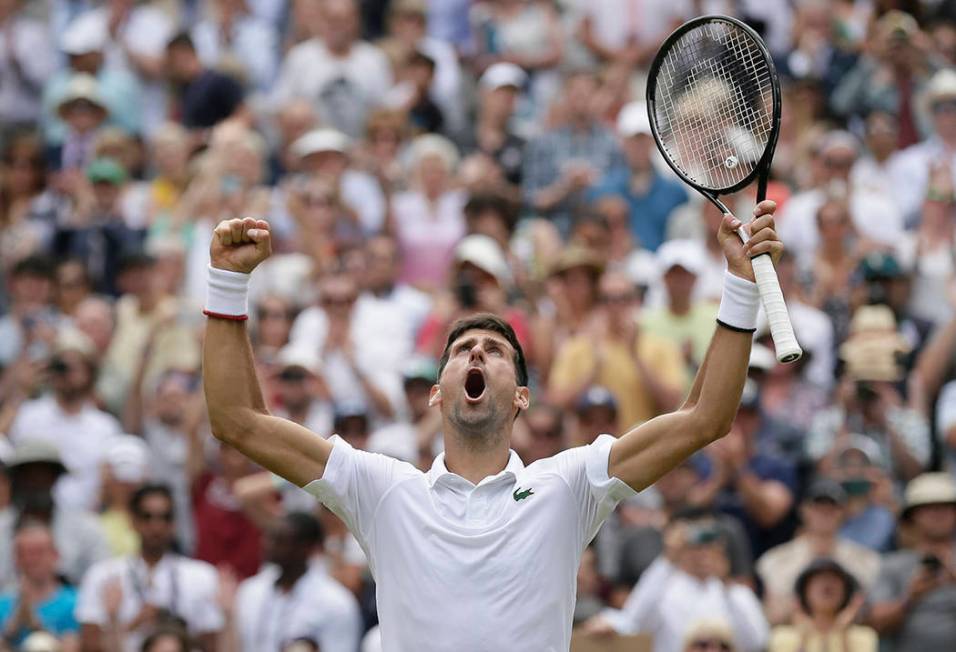 Serbia's Novak Djokovic celebrates defeating Belgium's David Goffin during a men's quarterfinal ...