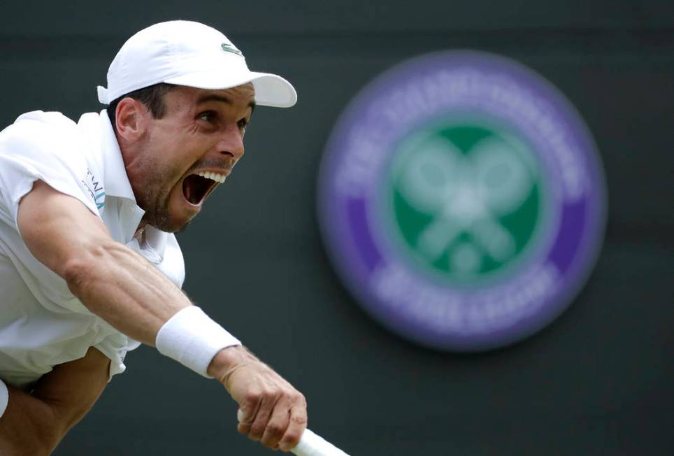 Spain's Roberto Bautista Agut serves to Argentina's Guido Pella during a men's quarterfinal mat ...