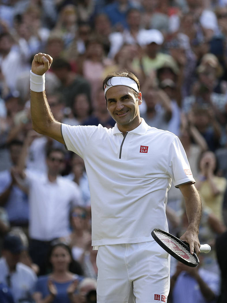 Switzerland's Roger Federer celebrates defeating Japan's Kei Nishikori during a men's quarterfi ...