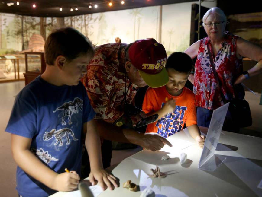 Jonathan Rolands, 7, of Las Vegas, from left, Jose Loya, his grandson, Bishop Loya, 7, and wife ...