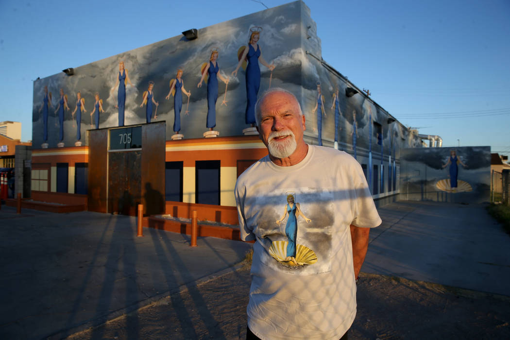 James Stanford with part of his mural, "A Phalanx of Angels Ascending" on the 705 Building at 7 ...