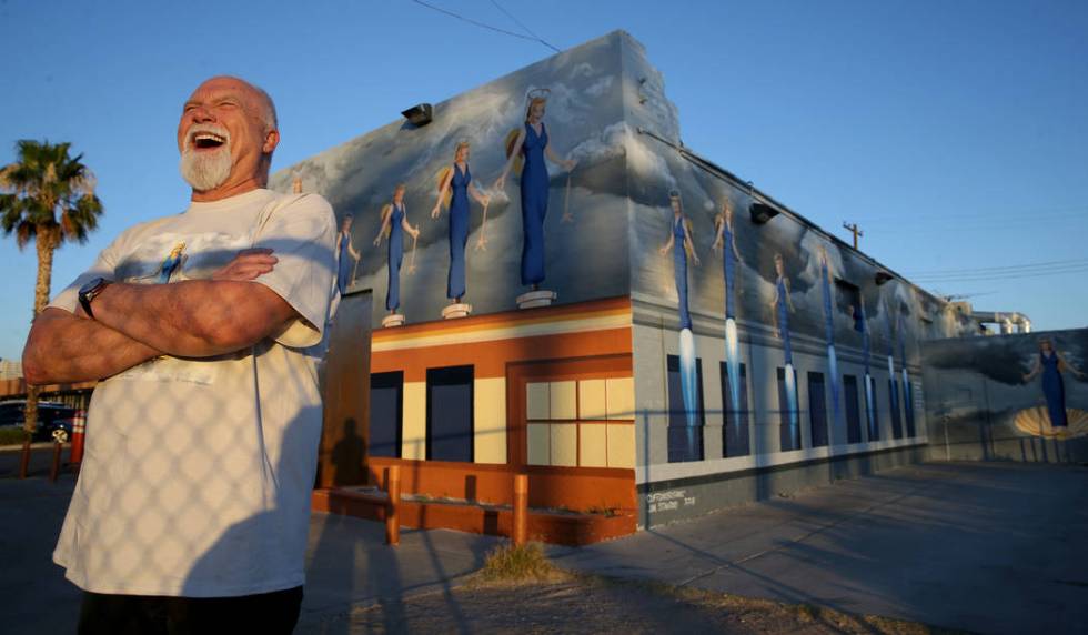 James Stanford with part of his mural, "A Phalanx of Angels Ascending" on the 705 Building at 7 ...